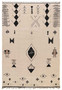 This is an image of a large, Moroccan-style rug measuring 7 feet 8 inches by 11 feet 4 inches, placed in a modern, well-lit space. The rug features a complex array of geometric patterns and tribal motifs, predominantly in black on an ivory background. The central design consists of a prominent diamond shape filled with a cross-like pattern. The rug is bordered by various abstract figures and symbols, some resembling animals and others more symbolic or botanical in nature. The fringe is neatly tied off at the ends, adding to its handcrafted appeal. This piece is likely to be the focal point of a minimalist or contemporary interior due to its bold yet neutral color scheme.
