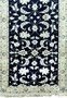 Close-up on the upper portion of the Persian Nain Runner, highlighting the intricate patterns and border design.