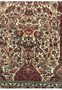 Close-up of the central design of the Persian Qum rug, focusing on the detailed floral medallion and the vibrant contrast of reds and creams with silk highlights.