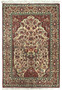 Full view of a 4'4" x 7' Persian Qum rug laid out flat, showcasing the intricate floral medallion design in the center with a detailed border, in a color palette of red, blue, cream, and silk accents.