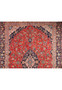 A full view of the Persian Kashan rug from the top, highlighting the symmetrical design and the border patterns that frame the intricate central field.