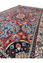 Edge view of a Persian Bijar rug showing the side binding and weave structure, illustrating the durability and expert craftsmanship of this hand-knotted wool rug