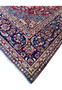 Corner detail of the Persian Isfahan Rug highlighting the vibrant colors and intricate patterns."