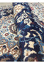 Rolled view highlighting fine weave and wool-silk texture