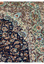 Corner view of Persian Isfahan rug with multicolored floral design and scrolling vine pattern