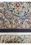 Back view of Persian Isfahan rug showing high knot density and clarity of intricate floral design