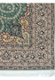 Corner detail showing arabesque motifs and floral scrolls on Isfahan rug