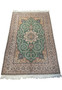 Angled view of Isfahan rug showing medallion and floral details