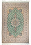 5'2 x 8 Persian Isfahan wool and silk rug with green field and medallion design