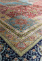 Hand-knotted silk fringe and edge of vintage Chinese oriental rug with Kurosh signature.