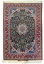 5x8 Signed Persian Isfahan Seirafian wool and silk rug with hunter green field, floral medallion, and crimson red borders.