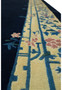 Close-up of ivory border with floral motifs on navy blue Beijing Art Deco rug. Close-up of ivory border with floral motifs on navy blue Beijing Art Deco rug.