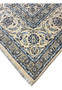 Ivory border with detailed blue floral arabesques on Persian Nain 9 LAA wool and silk rug