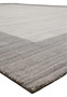 Contemporary solid gray wool rug angled view with subtle tonal variations
