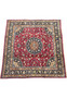 Angled view of Persian Mashad Rug showing rare square shape and bold floral design