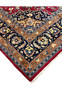 Corner detail of Mashad Rug with navy floral border and orange guard band