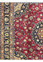 Side border of Persian Mashad Rug with navy floral scrolls, beige blossoms, and orange guard stripe