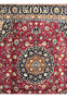 Medallion and border detail of Mashad Rug with intricate navy, gold, and ivory floral patterns