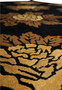 Repeating floral pattern in gold and camel on black 8x10 modern handmade wool rug
