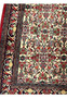 Detailed view of rug border and floral field patterns on Persian Bijar Halvaie Rug