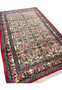 Angled perspective of 4'7 x 7'5 Persian Bijar Halvaie Rug with floral motifs