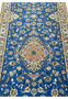 Close-up of 2'8 x 17'2 Persian Nain 6LA Runner showing lustrous off-white silk threads accenting the royal-blue floral motifs.