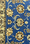 Detailed floral and vine motifs of Persian Nain rug with blue, beige, and ivory tones