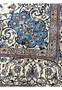 Inner border of Persian Nain 4 LA Habibian rug with soft ivory base, blue arabesque floral patterns, and golden accents woven in dense 4 LA knot work.