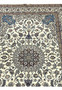 Close view of the Persian Nain 4 LA Habibian rug’s mid-section with intricate floral vines in blue, brown, and ivory tones woven with fine silk outlines.