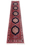 Long narrow Bijar runner laid flat, red field with repeating navy medallions and ivory centers, light borders, white fringe.
