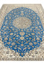 Midfield close-up of royal blue Persian Nain 6 LA rug highlighting silk accents and floral details.