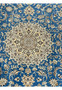 Intricate floral medallion pattern in royal blue and ivory on Persian Nain 6 LA rug.