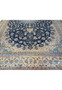 Lower border of 14x25'6 Persian Nain rug with ivory flowers and light blue scrollwork.