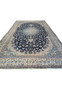 14x25'6 Nain 9 LA Persian rug laid flat with fold lines on navy and ivory floral pattern.