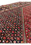 10x13 Bijar Persian Iron Rug field detail with bold red background and floral medallion geometry