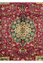 edge and fringe detail of Persian Tabriz rug with navy floral border and red outer band