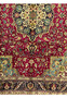 lower section of Persian Tabriz rug showing floral layout, rich red field, and multi-toned corner design