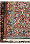 Reverse side of the Persian Bijar rug displaying border florals, geometric motifs, and sturdy wool foundation.