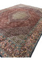 Angled view of Persian Bijar Iron Rug showing textured pile, medallion layers, and intricate floral motifs.