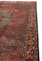 Side view of the Bijar Persian Iron Rug showing the floral border and geometric field layout.