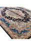 Angled view of the Tabriz rug showing wool-and-silk sheen, floral detailing, and medallion depth.