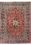Full view of the 9'9 x 14'5 vintage Najafabad Persian rug featuring a large medallion, ruby red field, and navy floral borders.