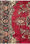 Side view of the 10x13 Patina Vintage Tabriz Rug showing worn areas, floral designs, and border contrast.