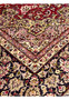 Inner border floral pattern of red Persian Isfahan rug with cream guard bands