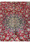 Closeup of central floral medallion on red Persian Isfahan rug in excellent condition”