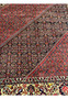 Inner lattice pattern of Persian Bijar rug showing dense knot structure
