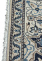 Backside of 3x5 Persian Nain rug showing tight knot structure, ivory weft threads, and fine high density weaving