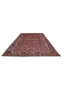 Large 6'6 x 9'6 Persian Bijar iron rug laid flat showing bold red field and repeating all over floral design