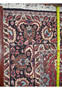 Backside view of a hand knotted 6'6 x 9'6 Persian Bijar iron rug showing dense weave and cotton foundation