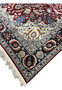 Edge detail of Persian Isfahan rug highlighting tight hand knotted construction, clean selvedge, and precise border definition